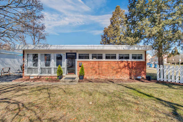 770 Spring Road Elmhurst, IL 60126 - Photo 1 of 35 a front view of a house with a yard outdoor seating and garage