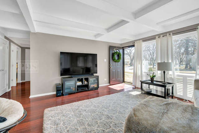 770 Spring Road Elmhurst, IL 60126 - Photo 11 of 35 a living room with furniture and a flat screen tv