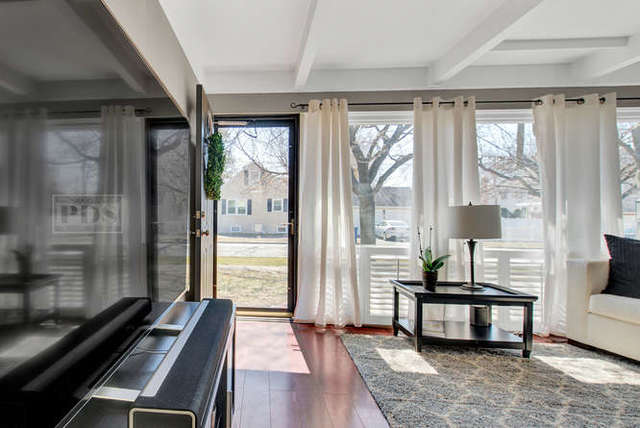 770 Spring Road Elmhurst, IL 60126 - Photo 12 of 35 a living room with furniture and a window