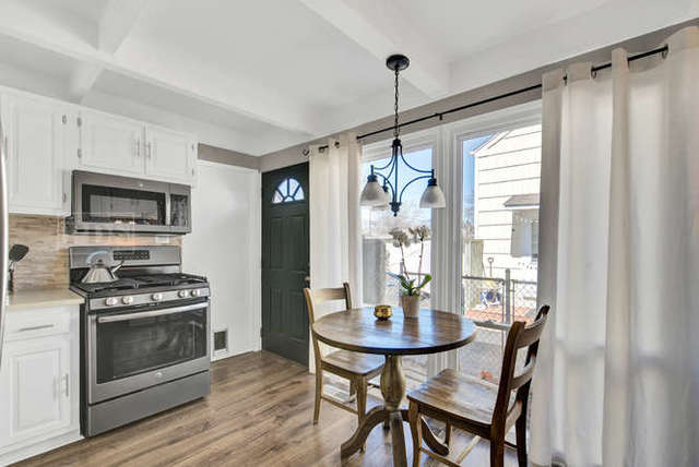 770 Spring Road Elmhurst, IL 60126 - Photo 14 of 35 a kitchen with a table and chairs in it