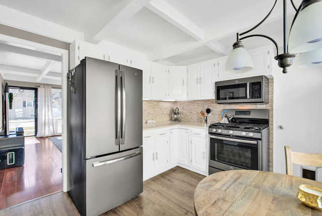 770 Spring Road Elmhurst, IL 60126 - Photo 17 of 35 a kitchen with a refrigerator stove and sink