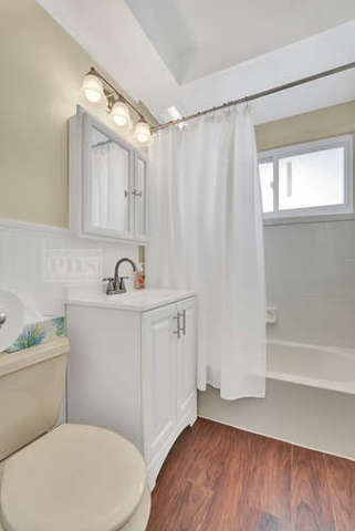 770 Spring Road Elmhurst, IL 60126 - Photo 21 of 35 a bathroom with a sink a toilet a mirror and shower