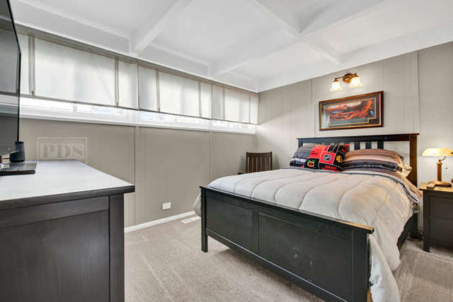 770 Spring Road Elmhurst, IL 60126 - Photo 23 of 35 a bedroom with a bed and a table