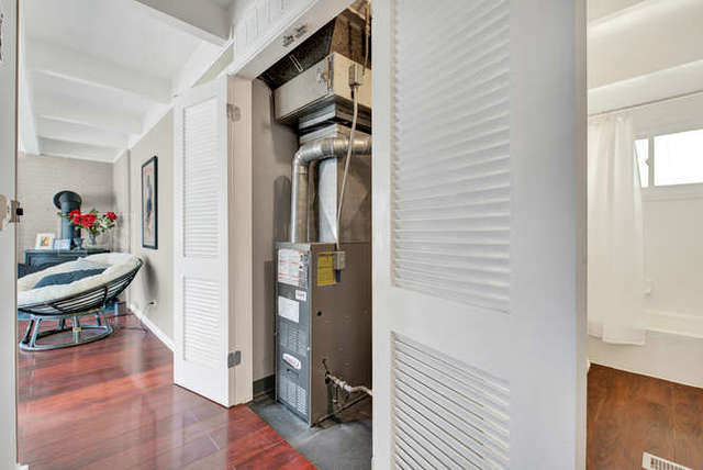 770 Spring Road Elmhurst, IL 60126 - Photo 27 of 35 a view of a hallway with wooden floor and furniture