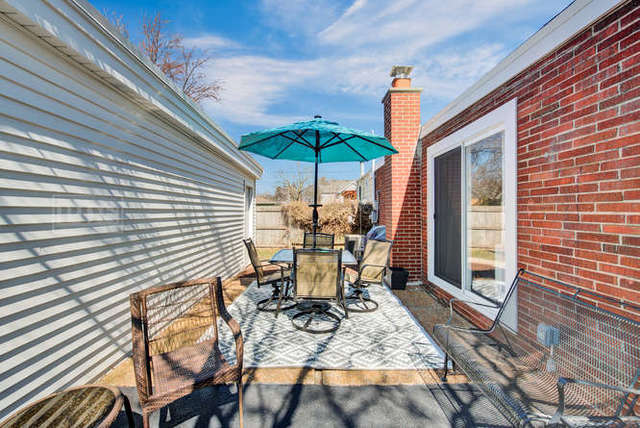 770 Spring Road Elmhurst, IL 60126 - Photo 29 of 35 a view of a patio with a table and chairs