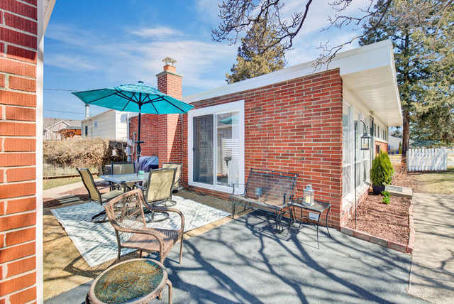 770 Spring Road Elmhurst, IL 60126 - Photo 30 of 35 a view of a patio with a table and chairs under an umbrella