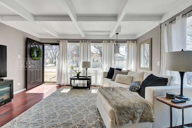 770 Spring Road Elmhurst, IL 60126 - Photo 9 of 35 a living room with furniture and a large window