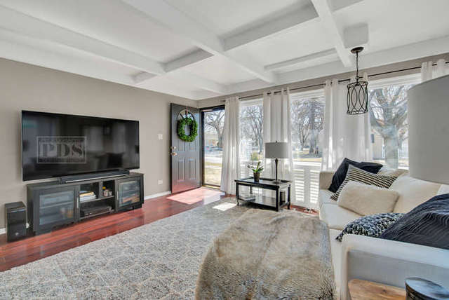 770 Spring Road Elmhurst, IL 60126 - Photo 10 of 35 a living room with furniture and a flat screen tv