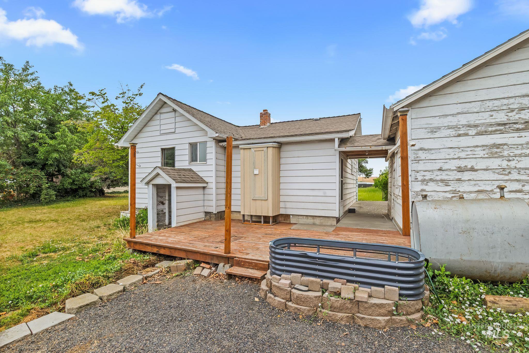 2255 Appleside Boulevard Clarkston, WA 99403 - Photo 28 of 41 Spacious outdoor deck with a visible detached metal building featuring two garage doors and a separate entry door