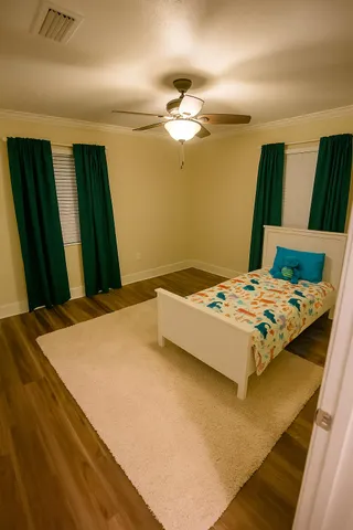 a bedroom with a bed and a mirror