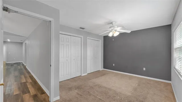 a view of a house with backyard porch and sitting area