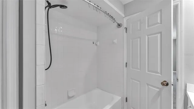 a view of a yard with wooden fence