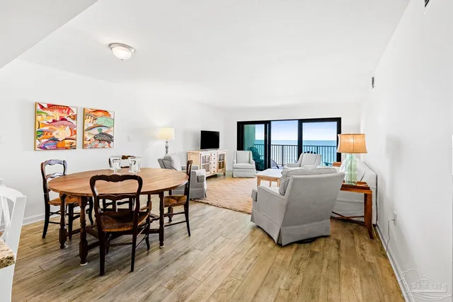 a kitchen with stainless steel appliances kitchen island granite countertop a stove and a sink