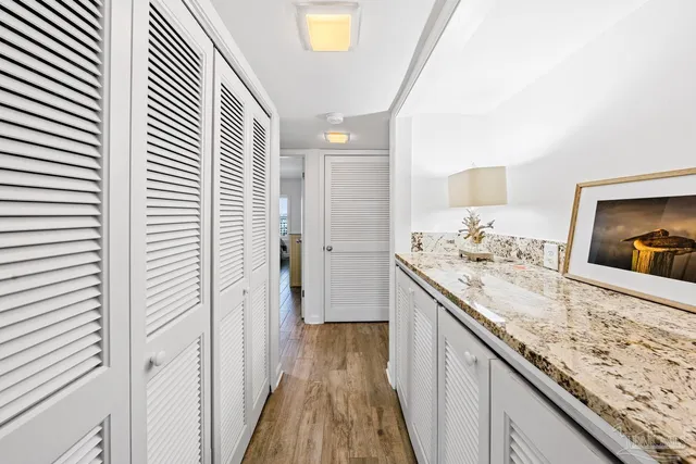 a bedroom with bed and a flat screen tv