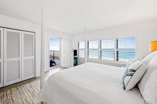 a bedroom with two beds and a flat screen tv