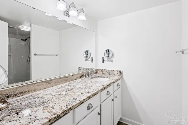 a bedroom with furniture and a book shelf