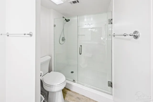 a living room with furniture and large windows