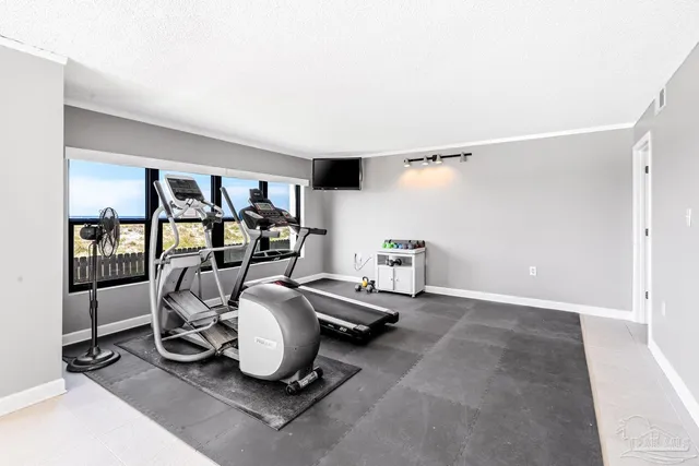 a view of a terrace with lawn chairs