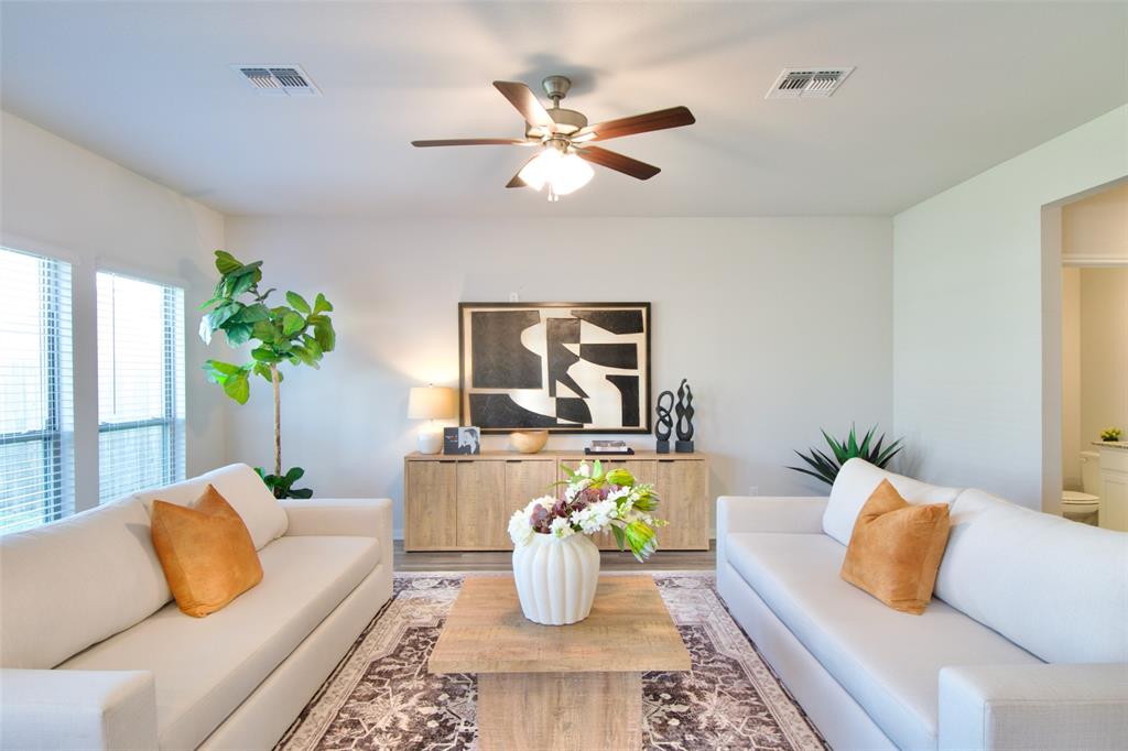 11229 Solar Street Lorena, TX 76655 - Photo 14 of 34 Living room featuring wood finished floors and a ceiling fan