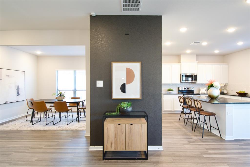 11229 Solar Street Lorena, TX 76655 - Photo 17 of 34 Kitchen with white cabinets, tasteful backsplash, recessed lighting, light wood finished floors, and a center island