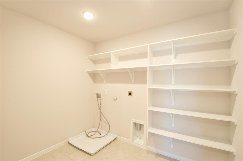 11229 Solar Street Lorena, TX 76655 - Photo 19 of 34 Laundry room with hookup for a gas dryer, washer hookup, and hookup for an electric dryer