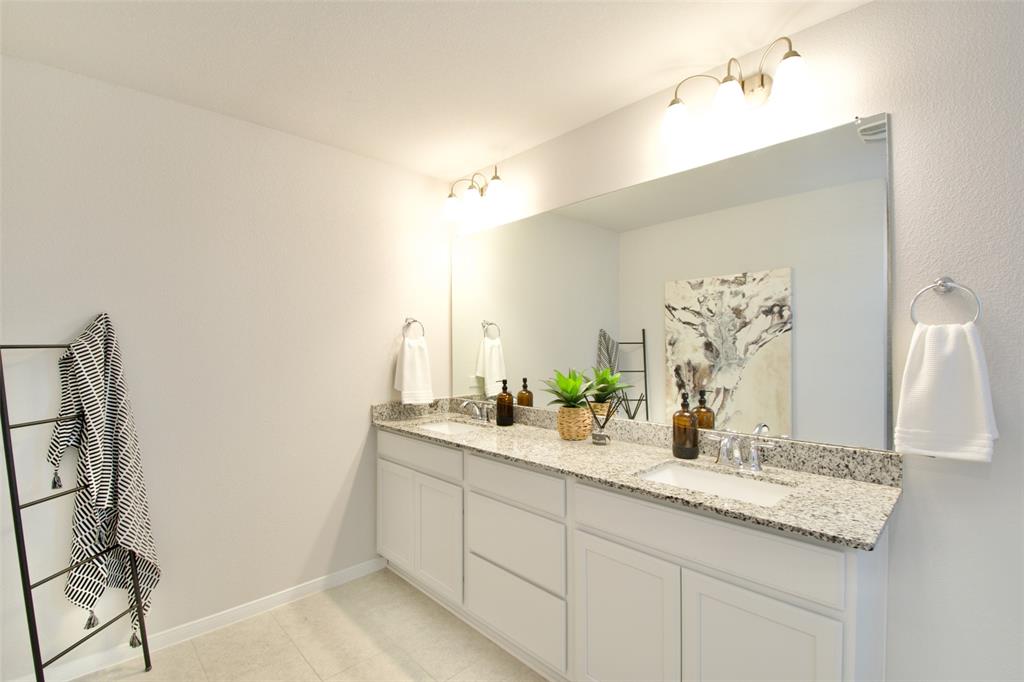11229 Solar Street Lorena, TX 76655 - Photo 26 of 34 Bathroom featuring double vanity and light tile patterned flooring