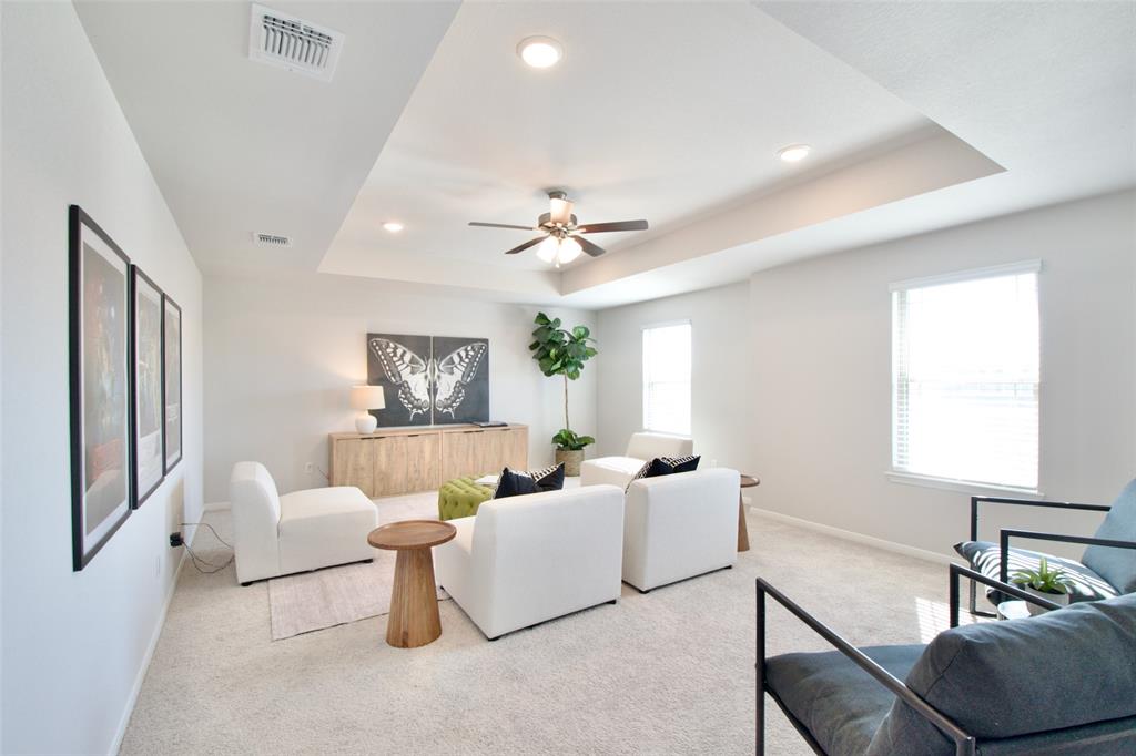 11229 Solar Street Lorena, TX 76655 - Photo 29 of 34 Living area featuring a raised ceiling, light colored carpet, healthy amount of natural light, recessed lighting, and a ceiling fan