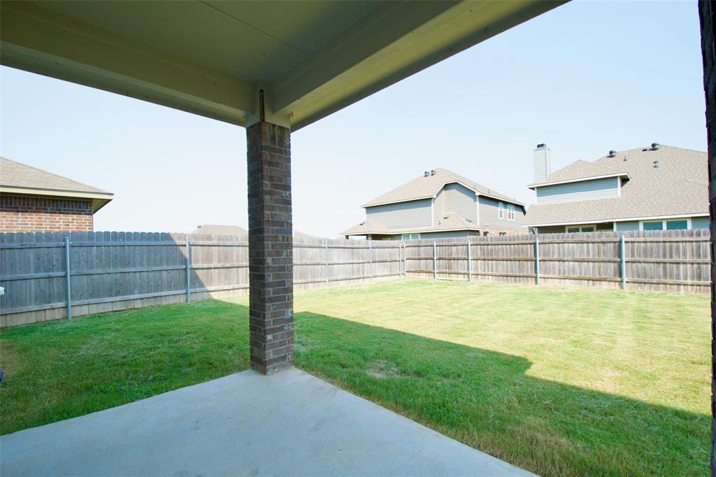 11229 Solar Street Lorena, TX 76655 - Photo 31 of 34 Fenced backyard with a patio area