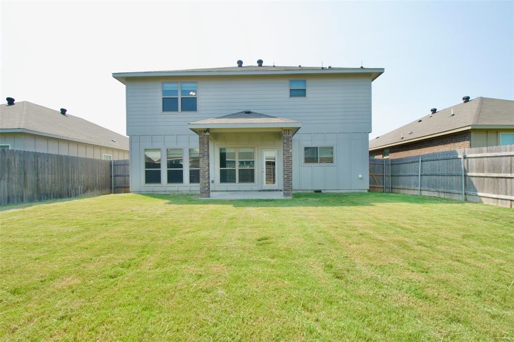 11229 Solar Street Lorena, TX 76655 - Photo 32 of 34 Rear view of house featuring a fenced backyard and a patio area