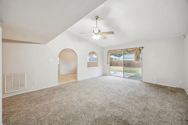 a view of an empty room with a window