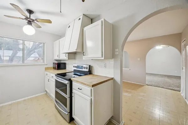 a view of a kitchen with a sink cabinets and window