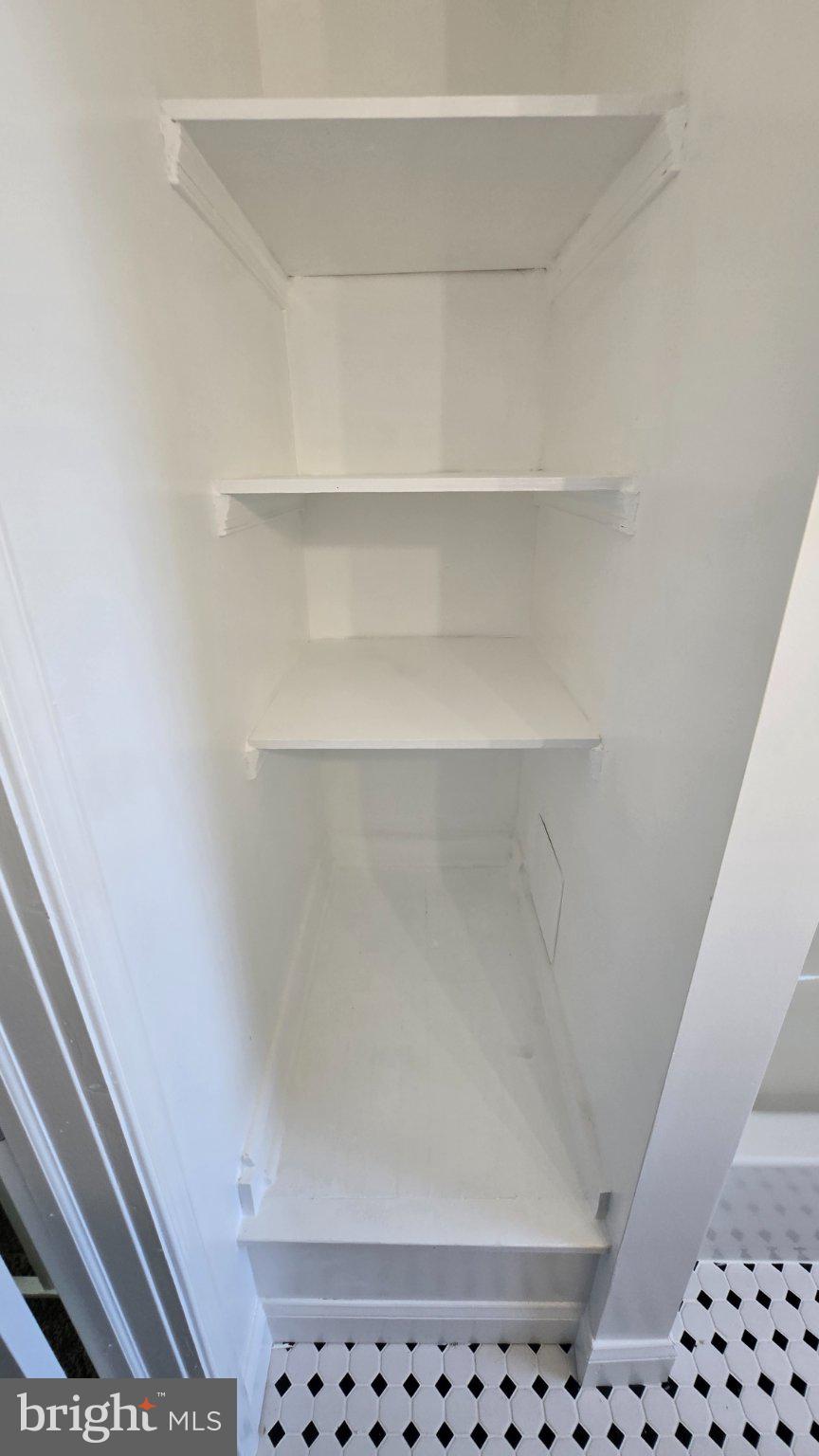 3820 Elkader Road Baltimore, MD 21218 - Photo 35 of 41 Sleek, modern shelving for organization.