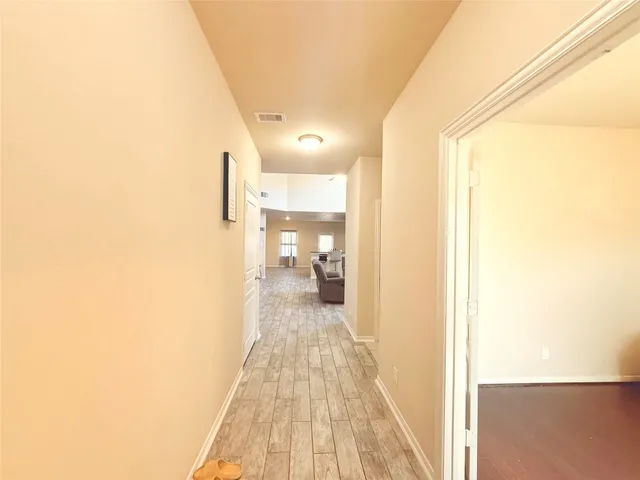 a view of a bedroom from a hallway