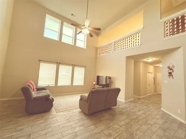 a living room with furniture and a window