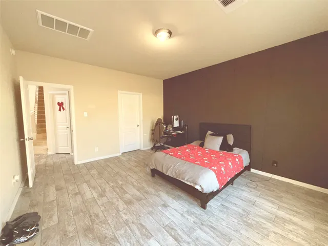 a bedroom with a bed and a table