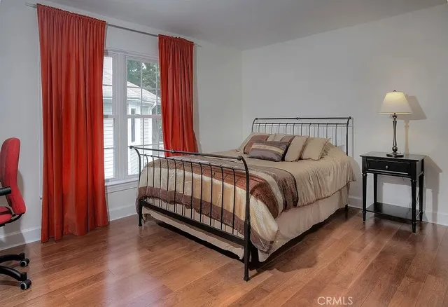 a bed room with a bed and a window