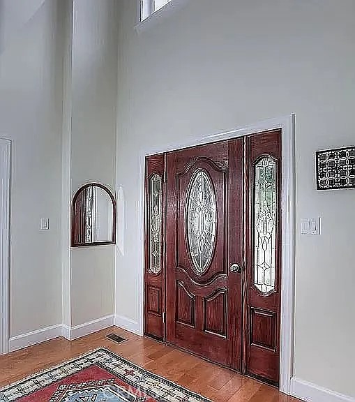 26 Anderson Hill Road Bernardsville, NJ 07924 - Photo 15 of 16 a front view of a house with entryway wooden floor and glass windows
