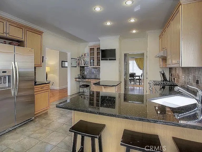 26 Anderson Hill Road Bernardsville, NJ 07924 - Photo 4 of 16 a kitchen with kitchen island granite countertop a sink refrigerator and cabinets