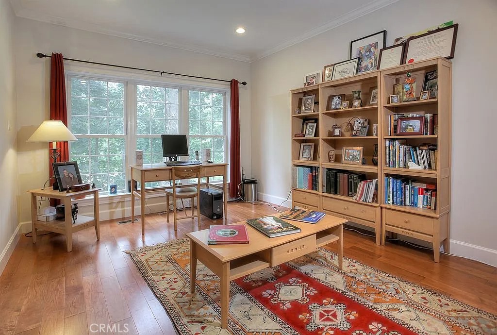 26 Anderson Hill Road Bernardsville, NJ 07924 - Photo 6 of 16 a living room with furniture a rug and a book shelf