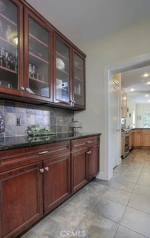 a kitchen with stainless steel appliances granite countertop a sink and cabinets
