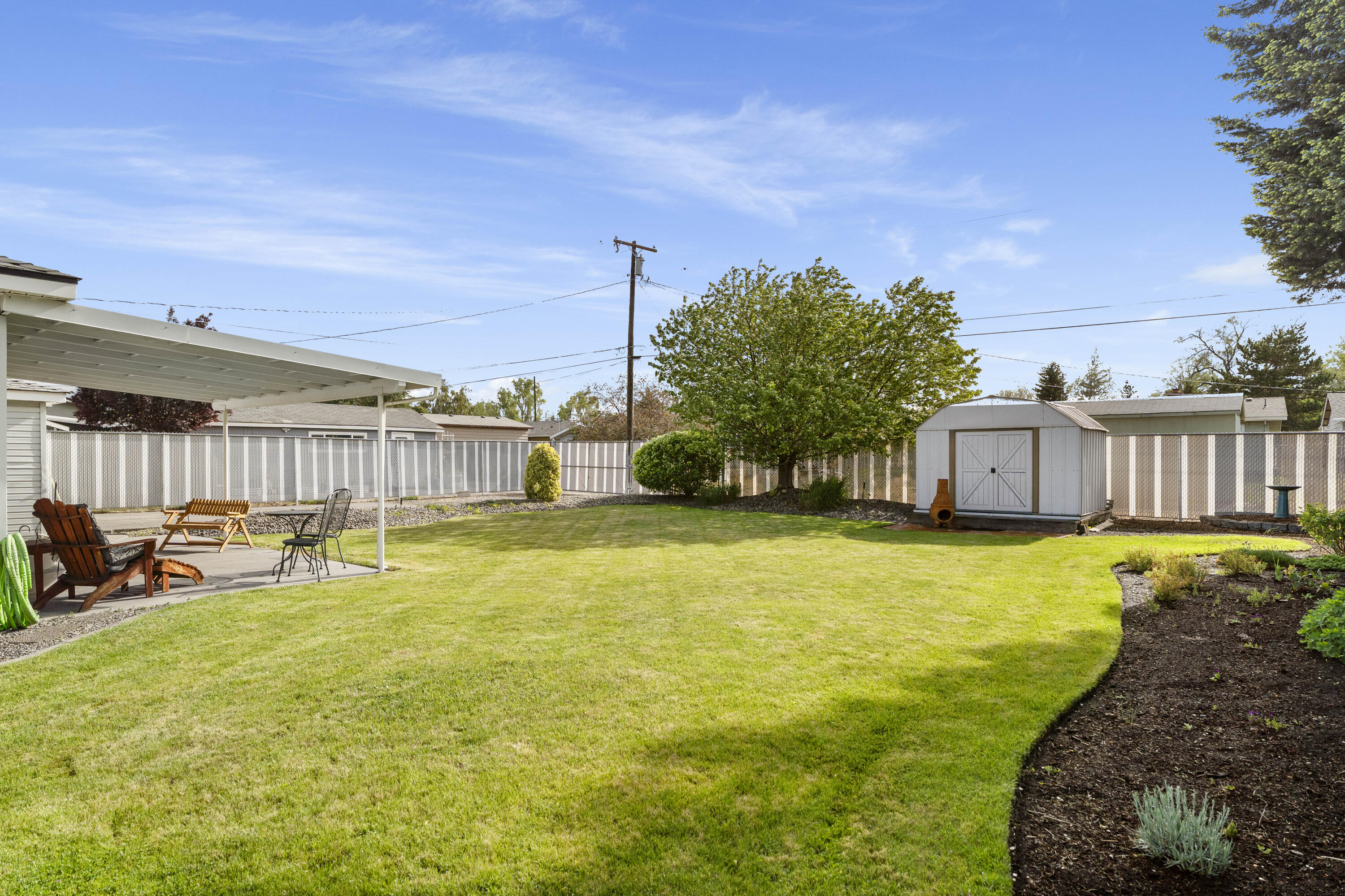 946 Southwest 13th Street Redmond, OR 97756 - Photo 42 of 49 a swimming pool with outdoor seating and yard
