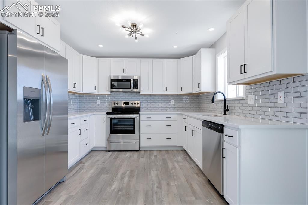 2975 North Ramah Highway Yoder, CO 80864 - Photo 6 of 43 a kitchen with cabinets stainless steel appliances and a counter space