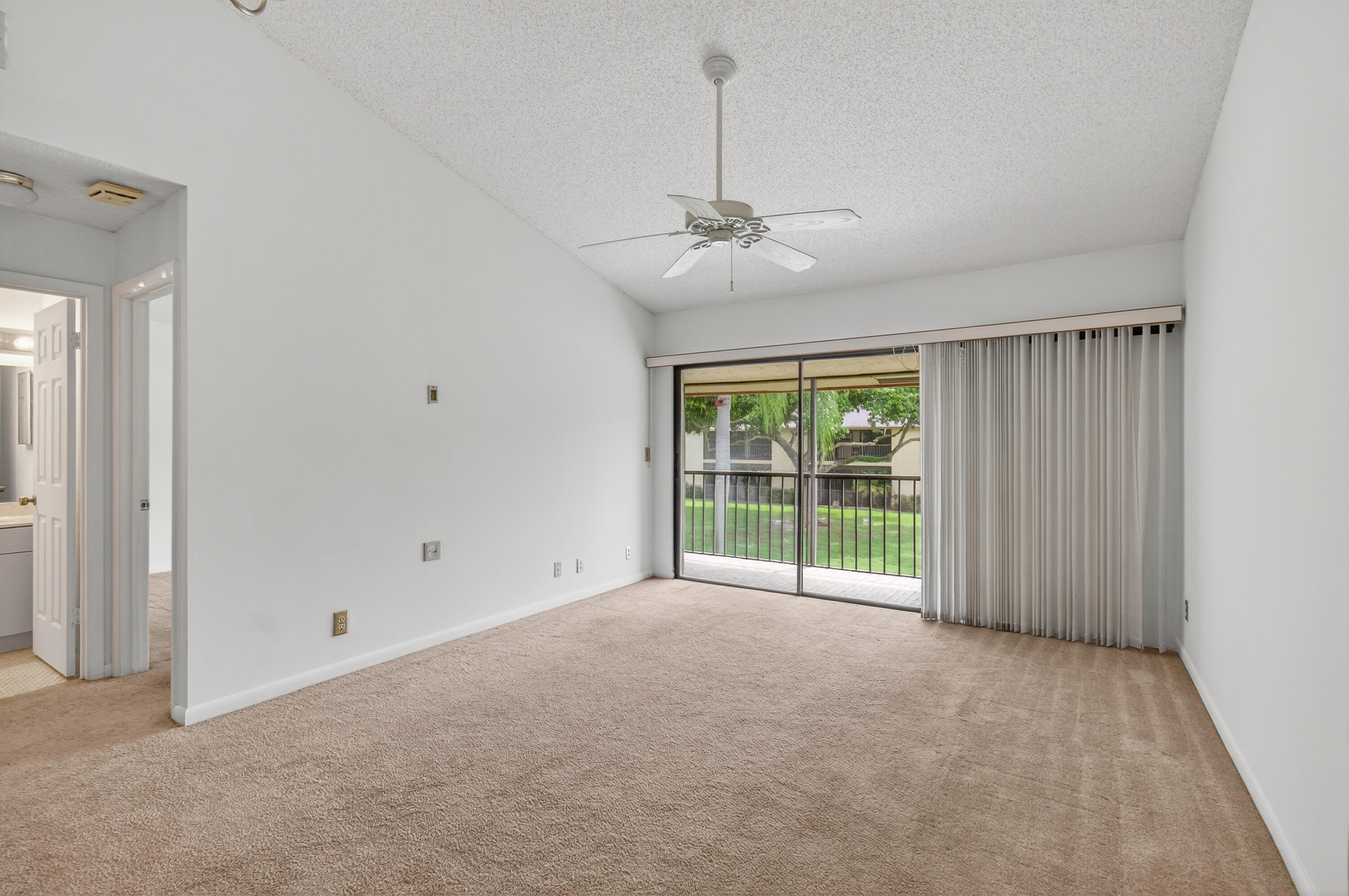 3939 Northeast 5th Avenue, Unit C203 Boca Raton, FL 33431 - Photo 20 of 30 a view of an empty room with a window