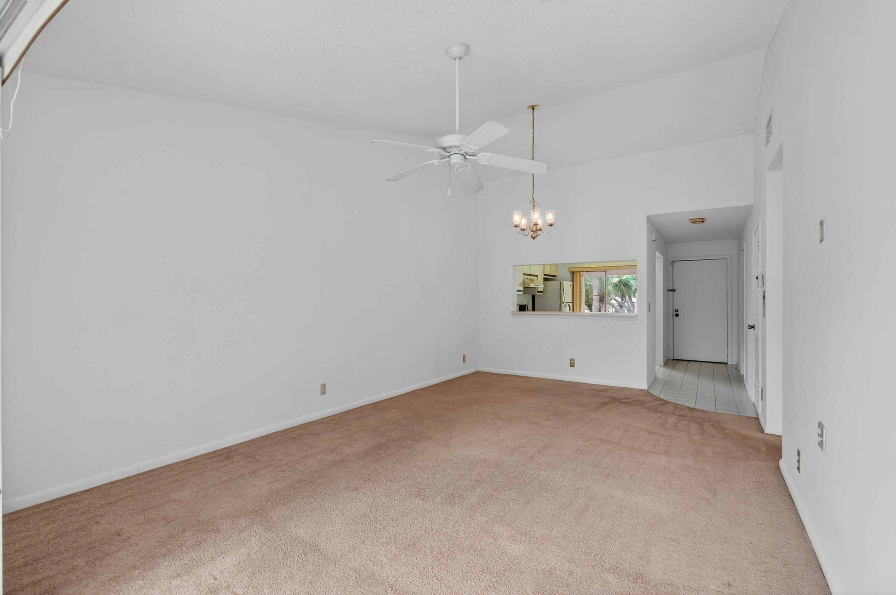 3939 Northeast 5th Avenue, Unit C203 Boca Raton, FL 33431 - Photo 21 of 30 an empty room with a empty space and a window