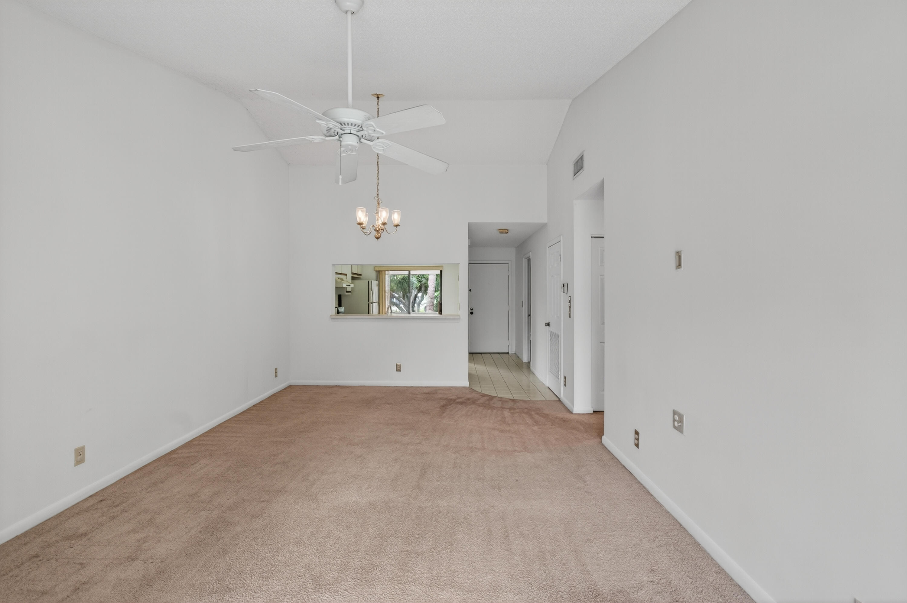 3939 Northeast 5th Avenue, Unit C203 Boca Raton, FL 33431 - Photo 22 of 30 en empty room with window and ceiling fan