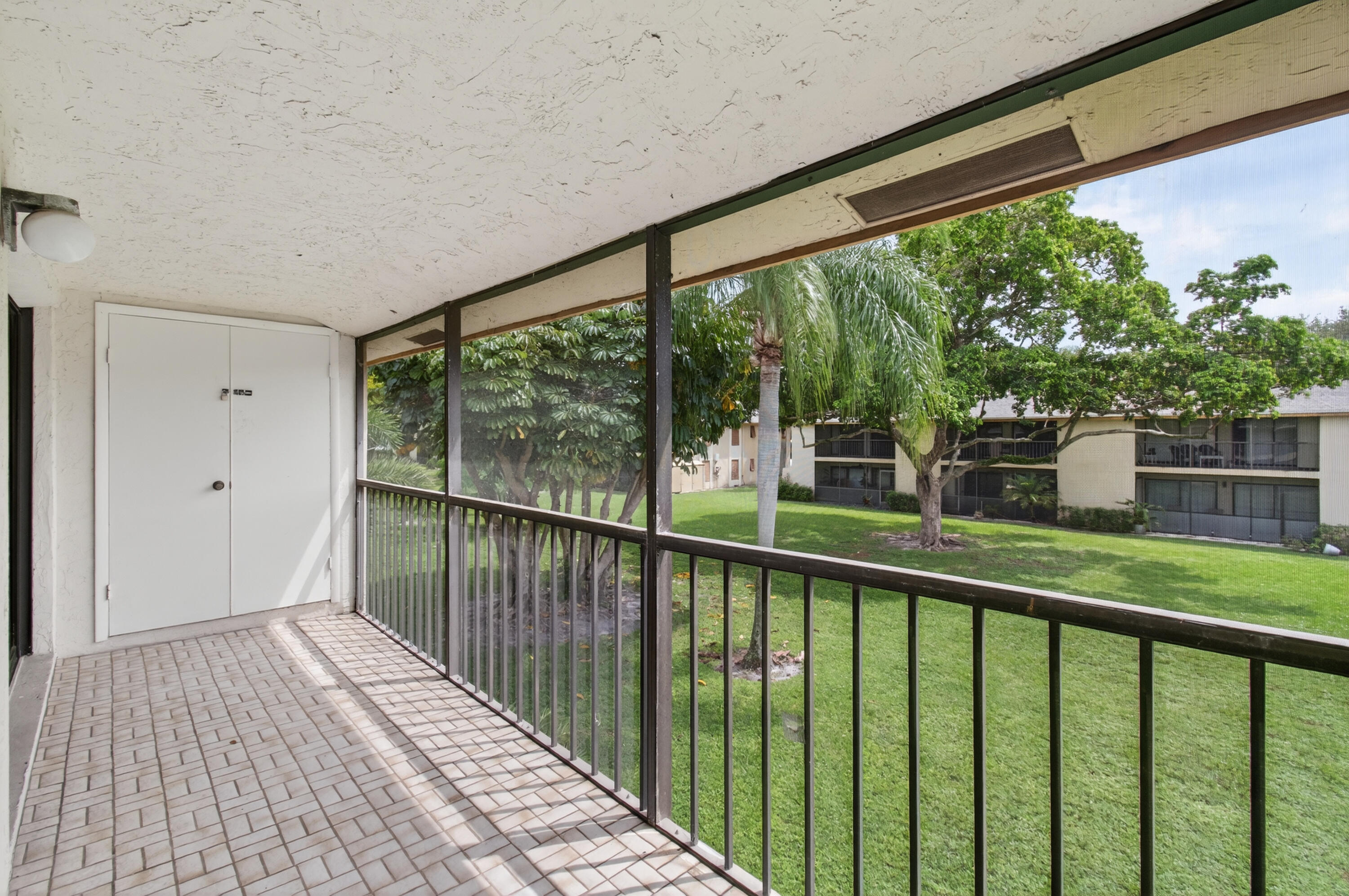 3939 Northeast 5th Avenue, Unit C203 Boca Raton, FL 33431 - Photo 24 of 30 a view of a balcony with wooden floor
