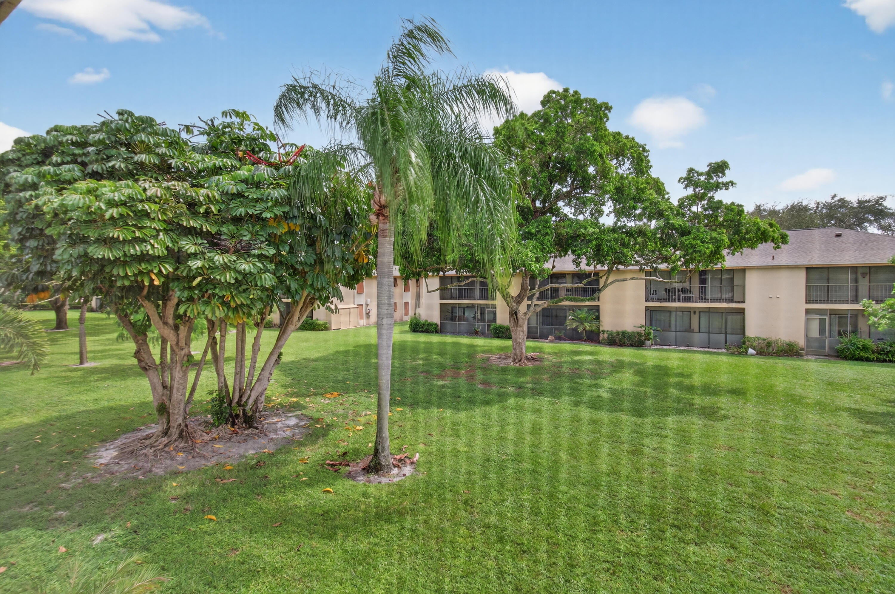 3939 Northeast 5th Avenue, Unit C203 Boca Raton, FL 33431 - Photo 29 of 30 a view of a backyard with a garden