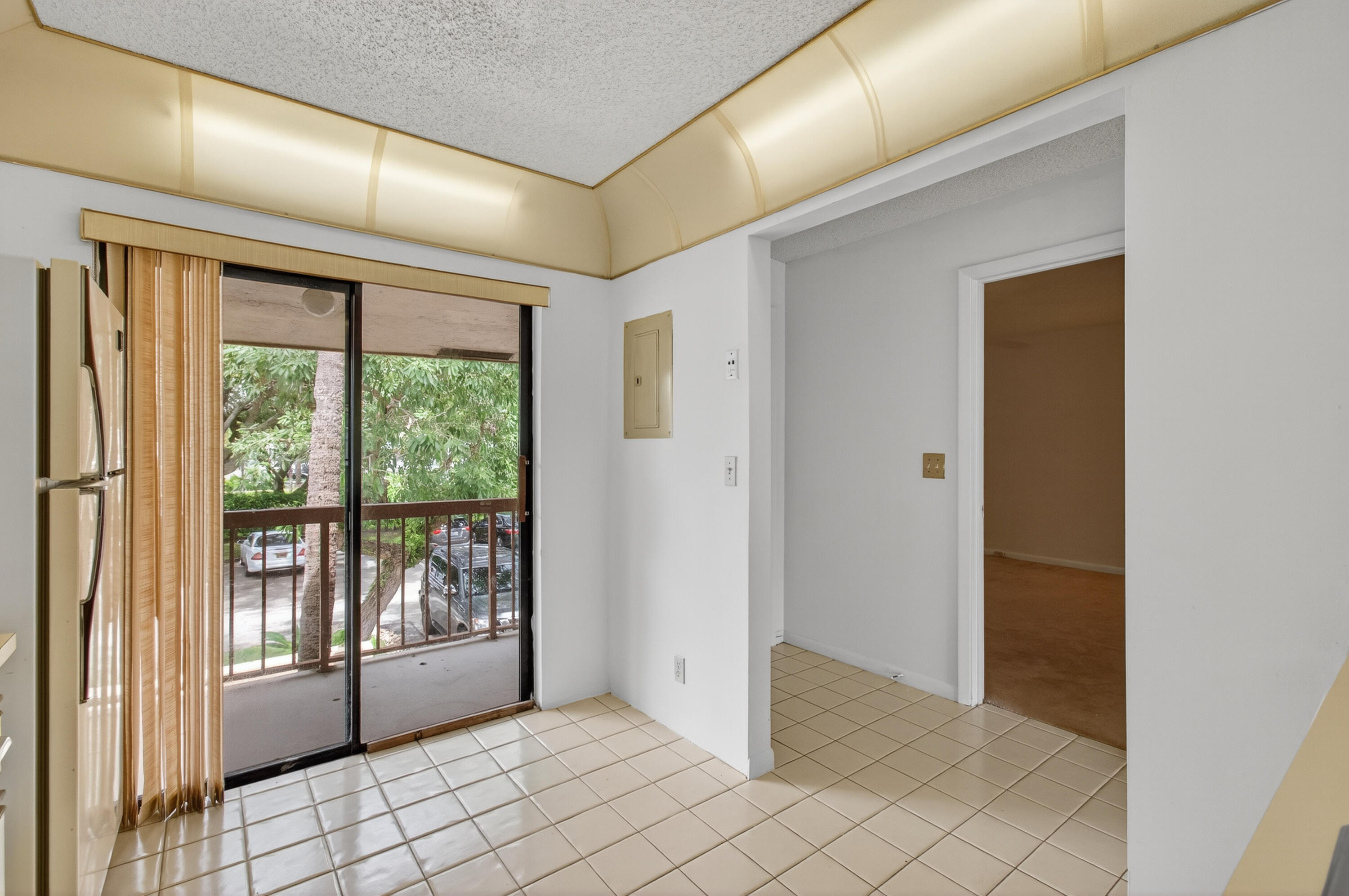 3939 Northeast 5th Avenue, Unit C203 Boca Raton, FL 33431 - Photo 5 of 30 a view of an empty room and window