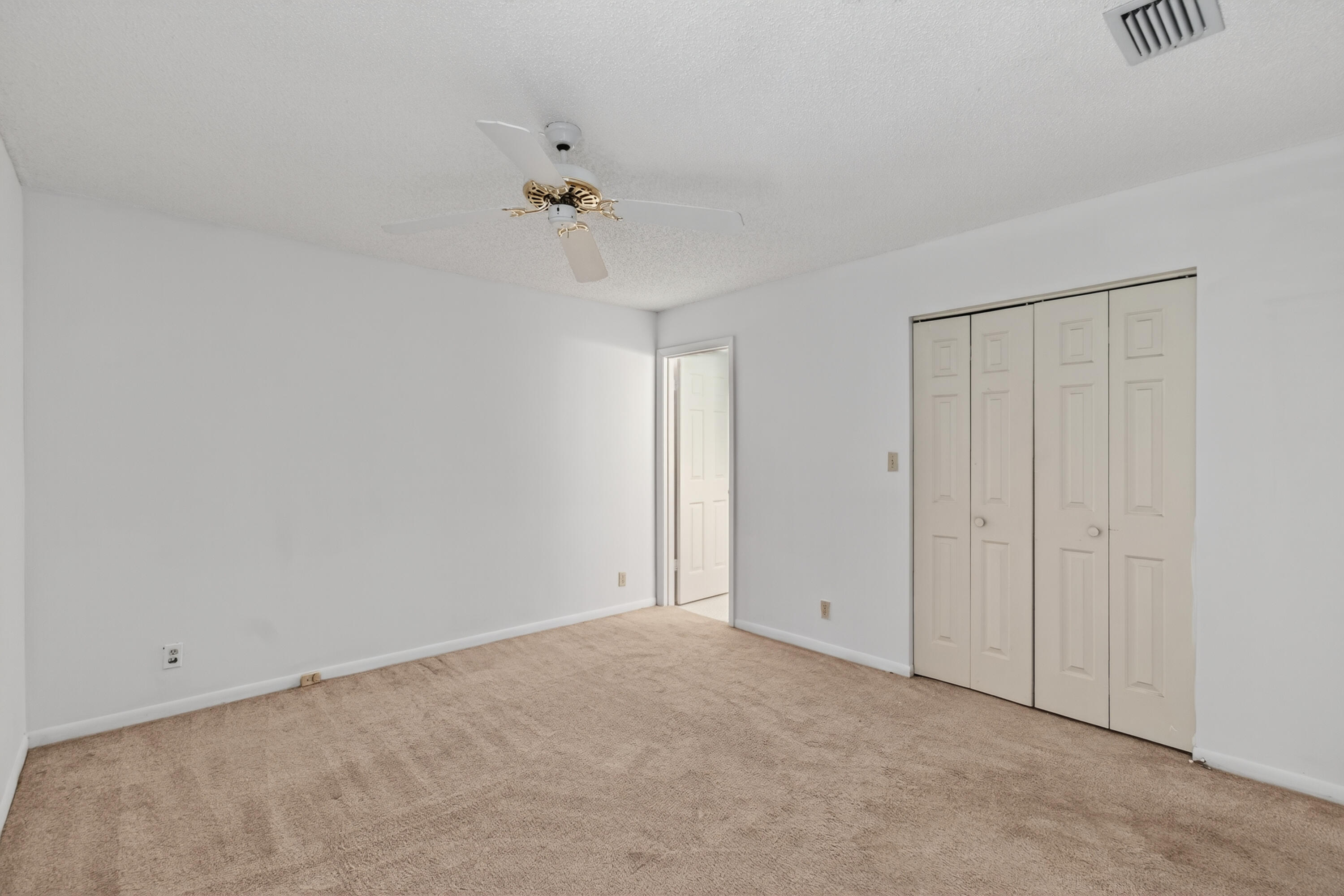 3939 Northeast 5th Avenue, Unit C203 Boca Raton, FL 33431 - Photo 9 of 30 a view of an empty room