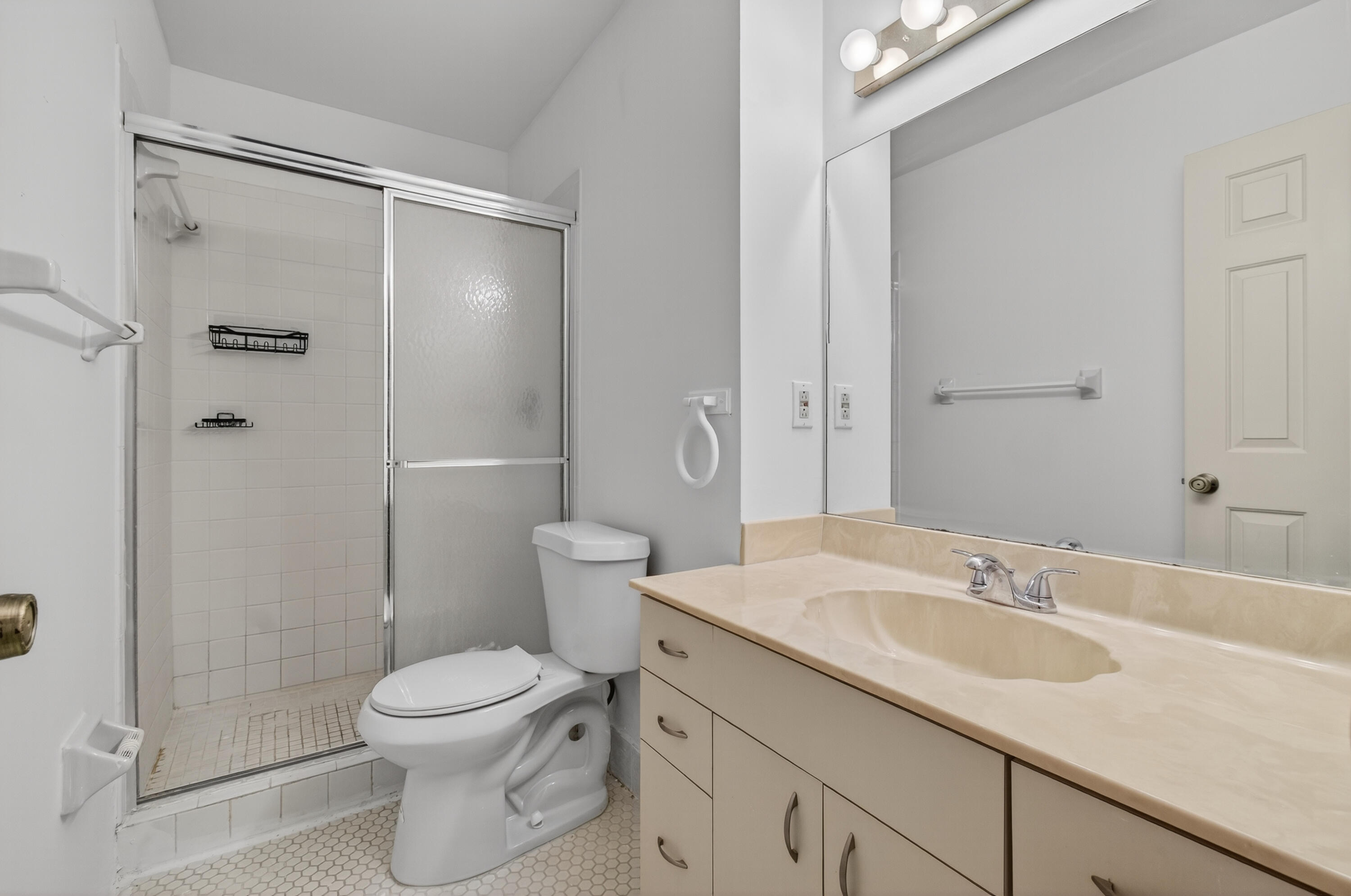 3939 Northeast 5th Avenue, Unit C203 Boca Raton, FL 33431 - Photo 10 of 30 a bathroom with a sink toilet and shower